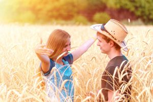 girl and a man in a cowboy hat